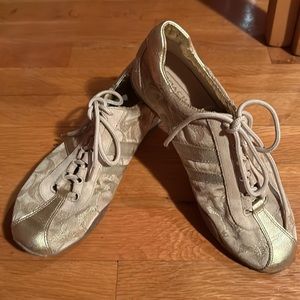 Beautiful gold COACH sneakers.